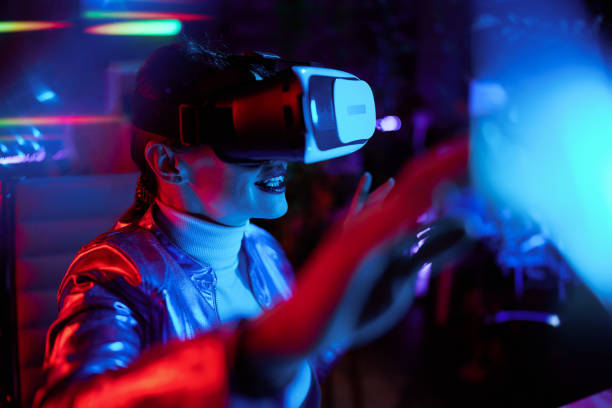istock stylish female in vr headset designing metaverse 1633802572