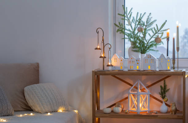 istock beautiful white room with christmas decor with burning candles 1633817147