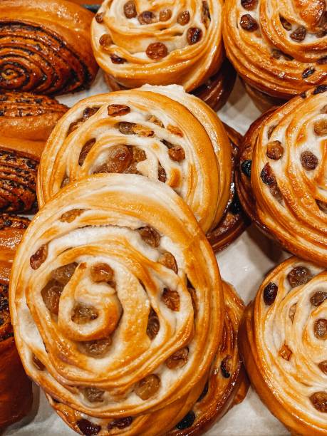 istock Crispy fresh sweet bread, pastry raisin buns. Fresh bakery concept. Top view. 1633823540