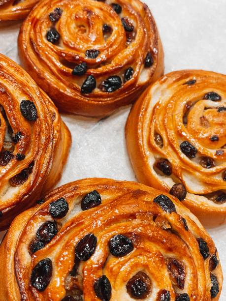 istock Crispy sweet bread, pastry raisin buns. Fresh bakery concept. Top view. 1633824072