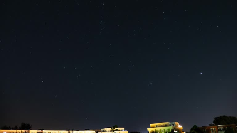 Night starry sky over the city.