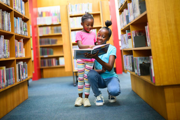 istock Looking at a storybook in the library 1633835830