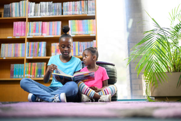 istock Relaxing & reading library storybooks together 1633836426