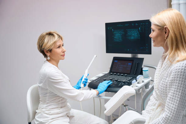 istock Gynecologist is preparing to diagnose patient using vaginal ultrasound device 1633840618