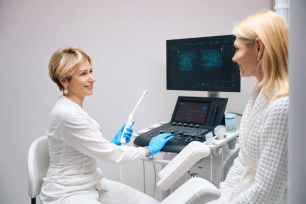 istock Gynecologist prepares patient for examination using vaginal ultrasound device 1633840620