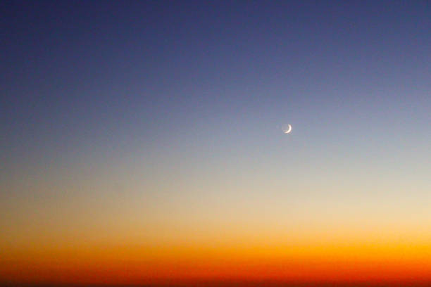 crescent and amazing sky at sunset