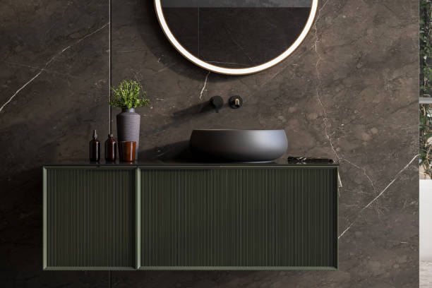 istock Oval mirror over black sink in stylish bathroom interior, black countertop. 1633883113