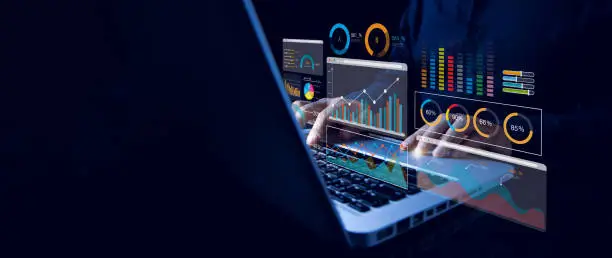 Photo of Analyst working with computer in Business Analytics and Data Management System with KPI and metrics connected to the database for technology finance, operations, sales, marketing. Data analysis.Ai