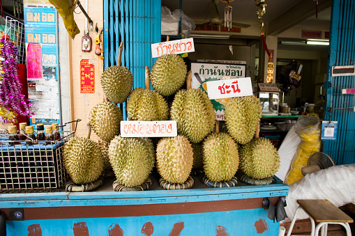 Durian (Tu-Rian) at a street food stall in the city of Bangkok, Thailand..
