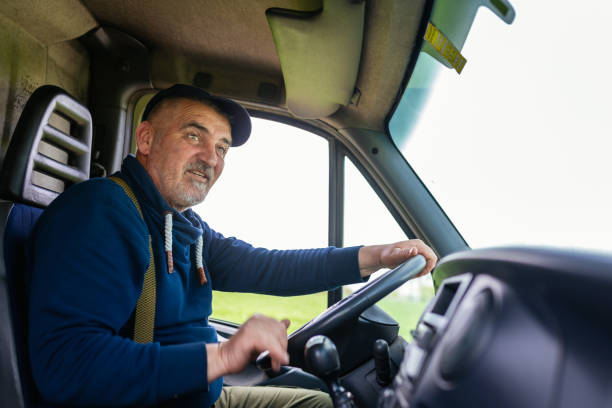 istock Professional driver driving a truck on the road. 1633948888