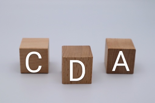 Photo of the letters CDA on building blocks