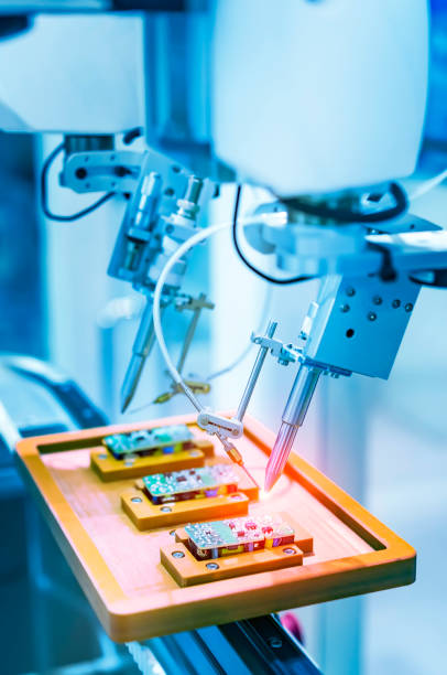 istock automatic robot for print circuit board (PCB)assembly machine during soldering or welding part 1633956266