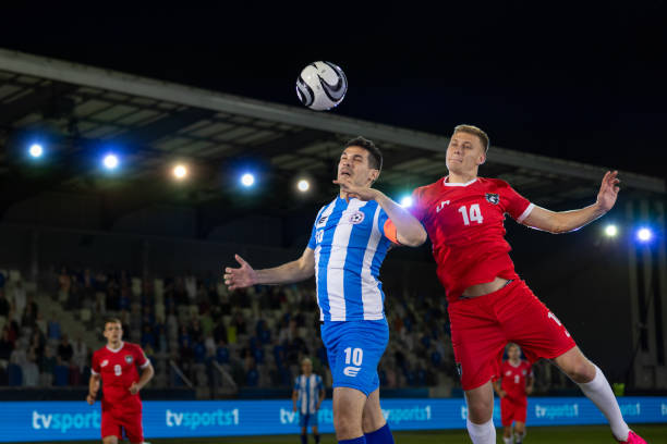 istock Football players playing during match 1633956963