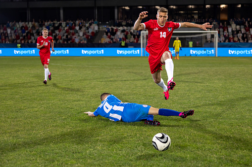 Two Professional Soccer Teams Posing for a Photo and Standing in Line. Professional Football Players Standing Before Important Match.