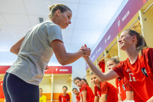 istock Coach motivating football player 1633956969