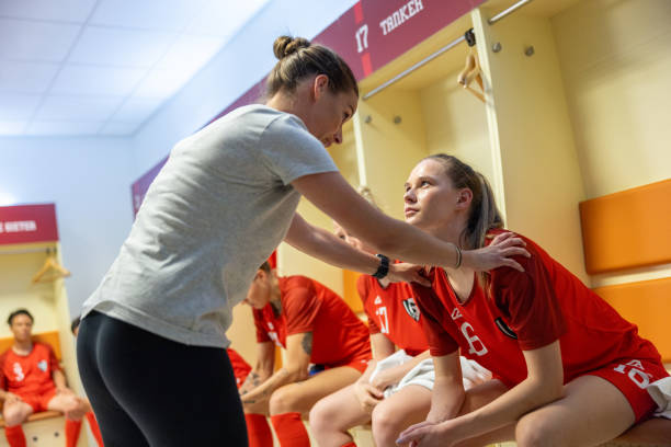 istock Coach motivating football player 1633957002