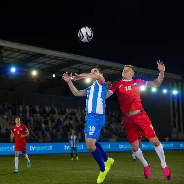 istock Football players playing during match 1633957011