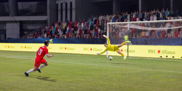 istock Goalkeeper defending football 1633957043