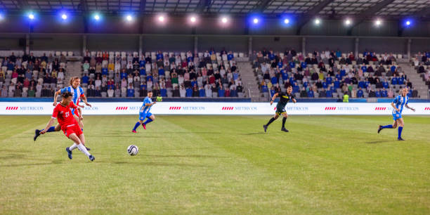 istock Female players playing football 1633957049