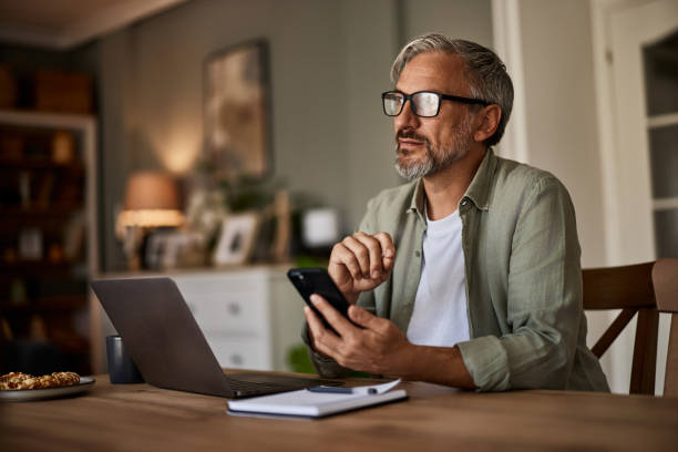 istock An older man ponders a message on his phone. 1633957960