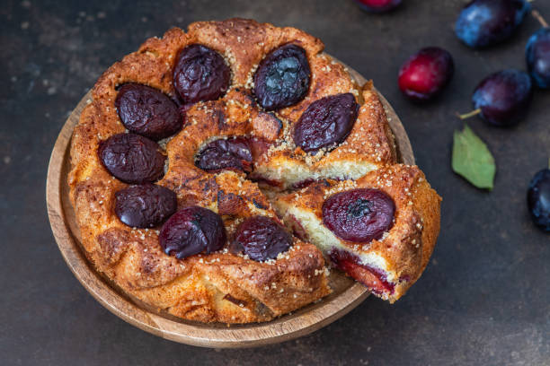 istock Delicious homemade plum cake on a dark background 1633992501