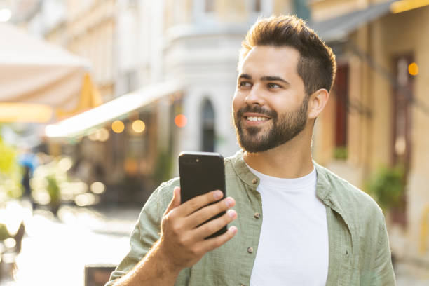 istock Young adult man use smartphone typing text messages browsing internet finishing work chatting online 1633993098