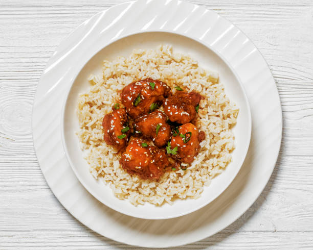 istock Baked Honey Sesame Chicken with brown rice 1634002156