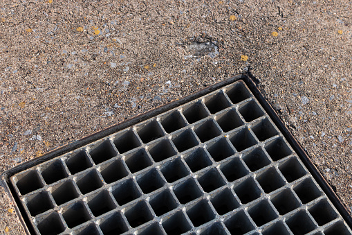 manhole cover on the concrete floor