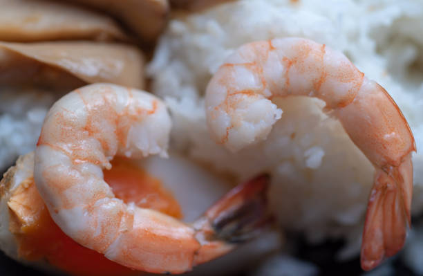 Close-up view peeled shrimp on rice
