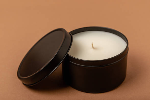 istock Soy candle in a black candlestick on a background. Space for text. Decor. 1634008222