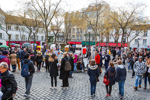 Paris (Montmartre),France - Feb. 07, 2016: Place du Tertre in Montmartre, Paris with street artists and paintings