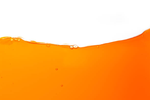 istock Macro orange juice texture isolated white background,Close-up Orange juice with bubbles on a white background. 1634020739