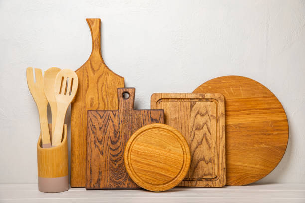 istock Cutting board on a textured kitchen table. Menu food card or recipes background concept.MOCKUP. Design. Place for text, copy space. The concept of food and cooking. 1634021333