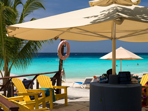 Adirondack chairs and umbrellas on Playa PortoMari, Curacao