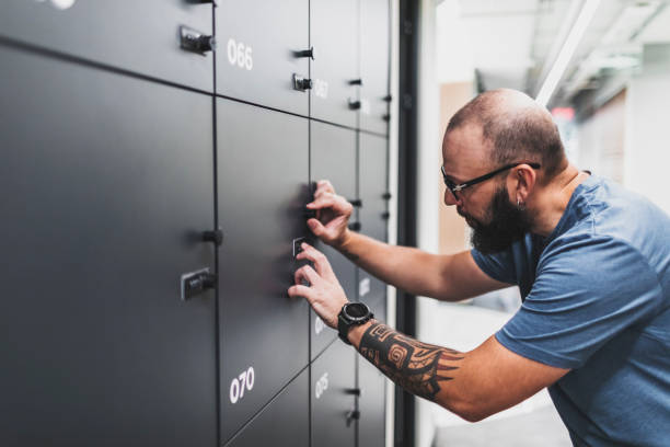 istock Adult man opening locker and stealing 1634054754