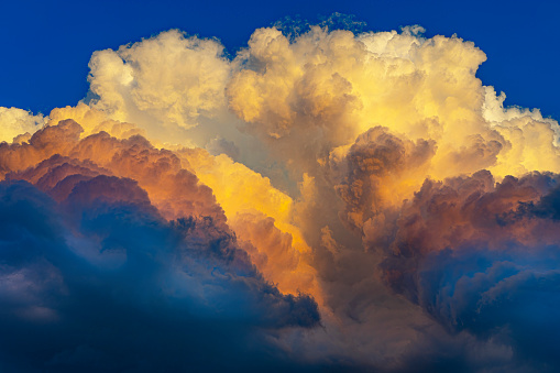Amazing textured colorful storm clouds forming in the East at sunset.