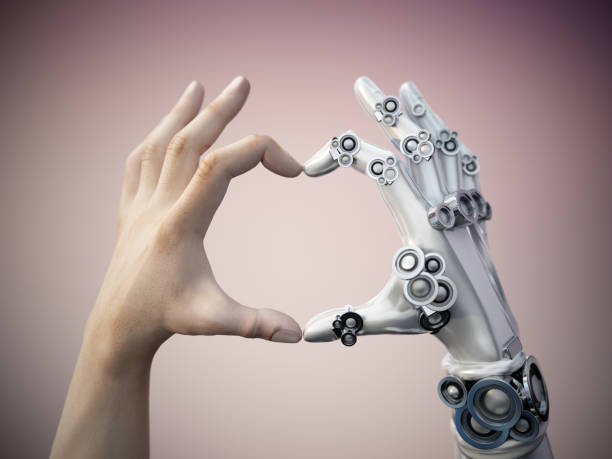 Human and robot hands forming a heart shape together. AI and human collaboration concept Human and robot hands forming a heart shape together. AI and human collaboration concept. robotic arm stock pictures, royalty-free photos & images