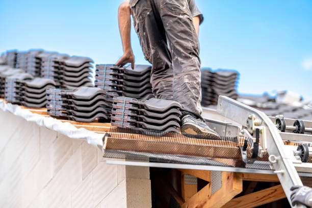 istock contractor builder laying fired ceramic tiles on the roof 1634087875