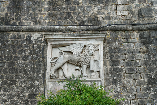 Kotor, Montenegro - June 16, 2017: Venetian Winged Lion Symbol on Old Town Walls - Kotor - Montenegro. World Heritage site of UNESCO