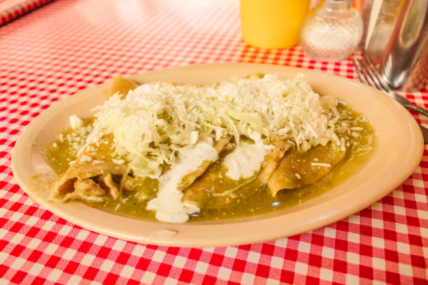 istock Green enchiladas with cheese, typical Mexican food 1634101897