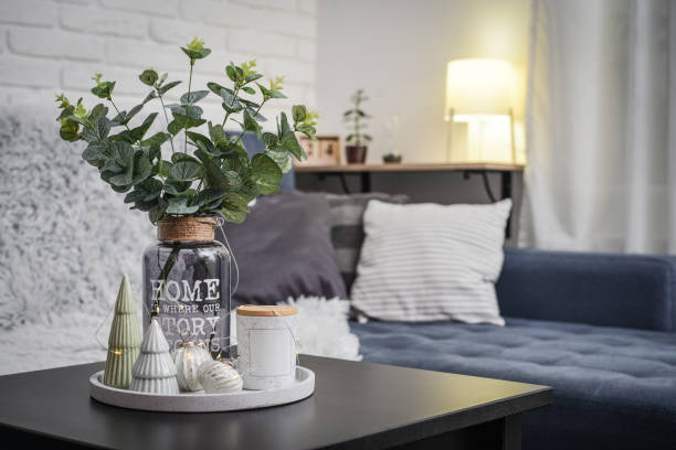 istock Christmas decorations with candle on coffee table 1634111052