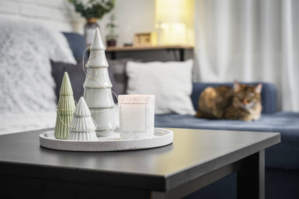 istock Christmas decorations with candle on coffee table 1634111603