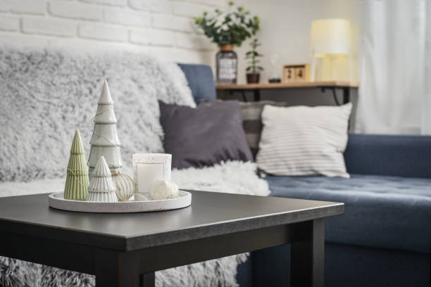 istock Christmas decorations with candle on coffee table 1634111613