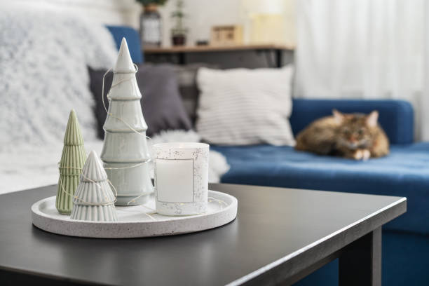istock Christmas decorations with candle on coffee table 1634112174