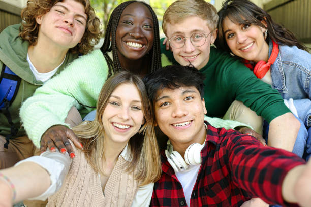 istock Multi-ethnic group of students doing selfie outside of the school 1634120229
