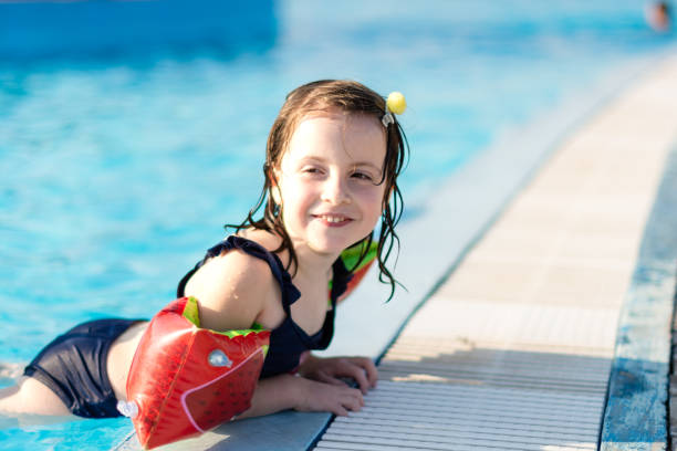 istock Girl in the pool 1634129985