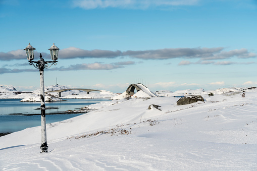Long bridge at Torsfjorden fjord near village Fredvang on island of Moskenesøya in the Lofoten archipelago in Nordland county in winter.