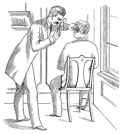 Audiologist using a mirror ophthalmoscope and aural speculum on a patient. Vintage etching circa 19th century.