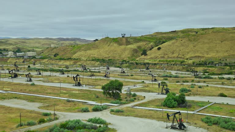 Ascending Drone Flight Over Pumpjacks in a California Oil Field