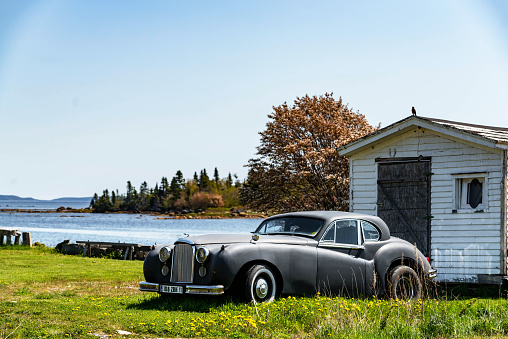 A classic car parked at backyard. Gambo, Newfoundland and Labrador, canada.